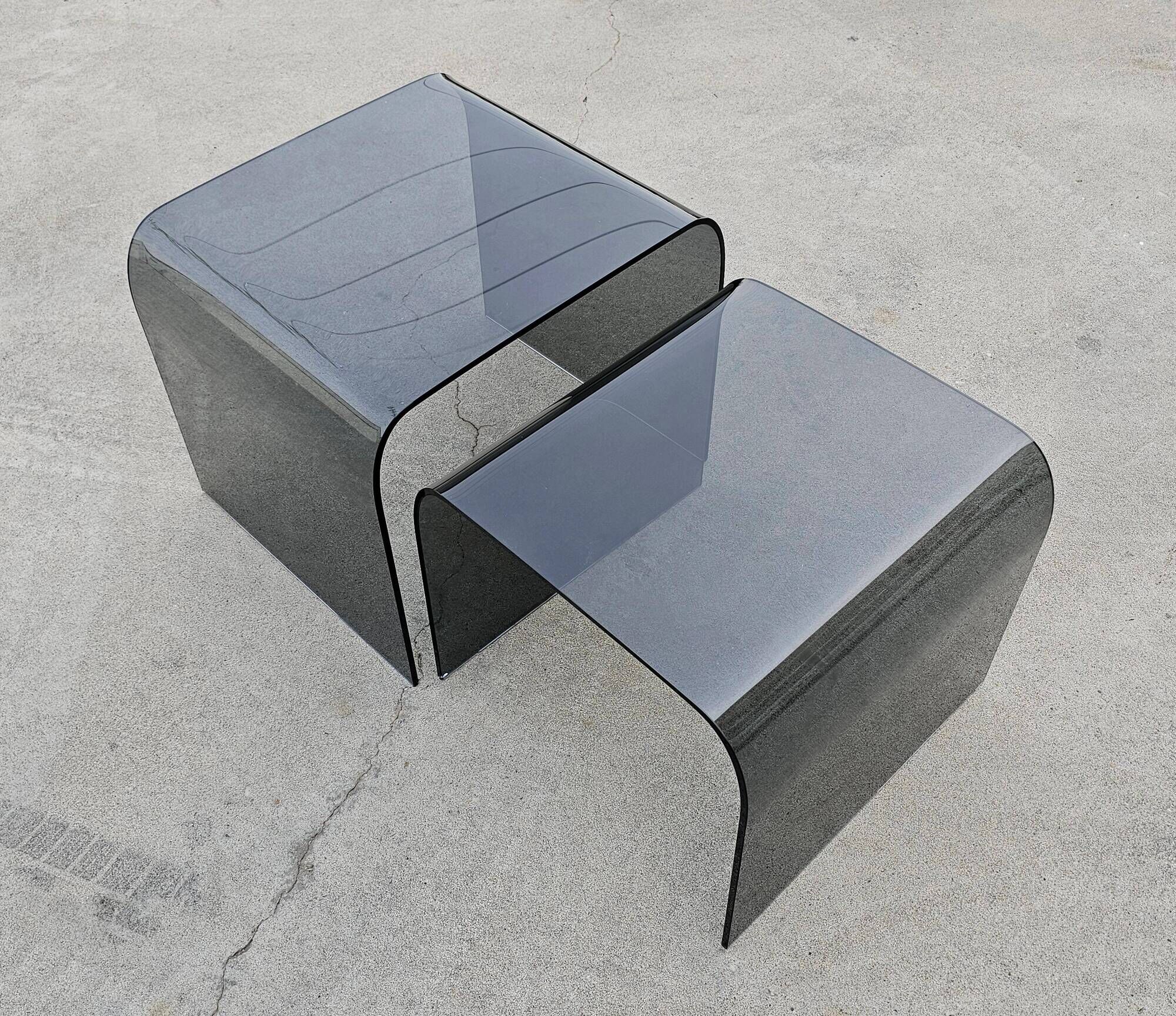 Pair of Waterfall nesting tables in tinted glass attributed to FIAM 1980s.