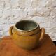 Old yellow glazed terracotta pot