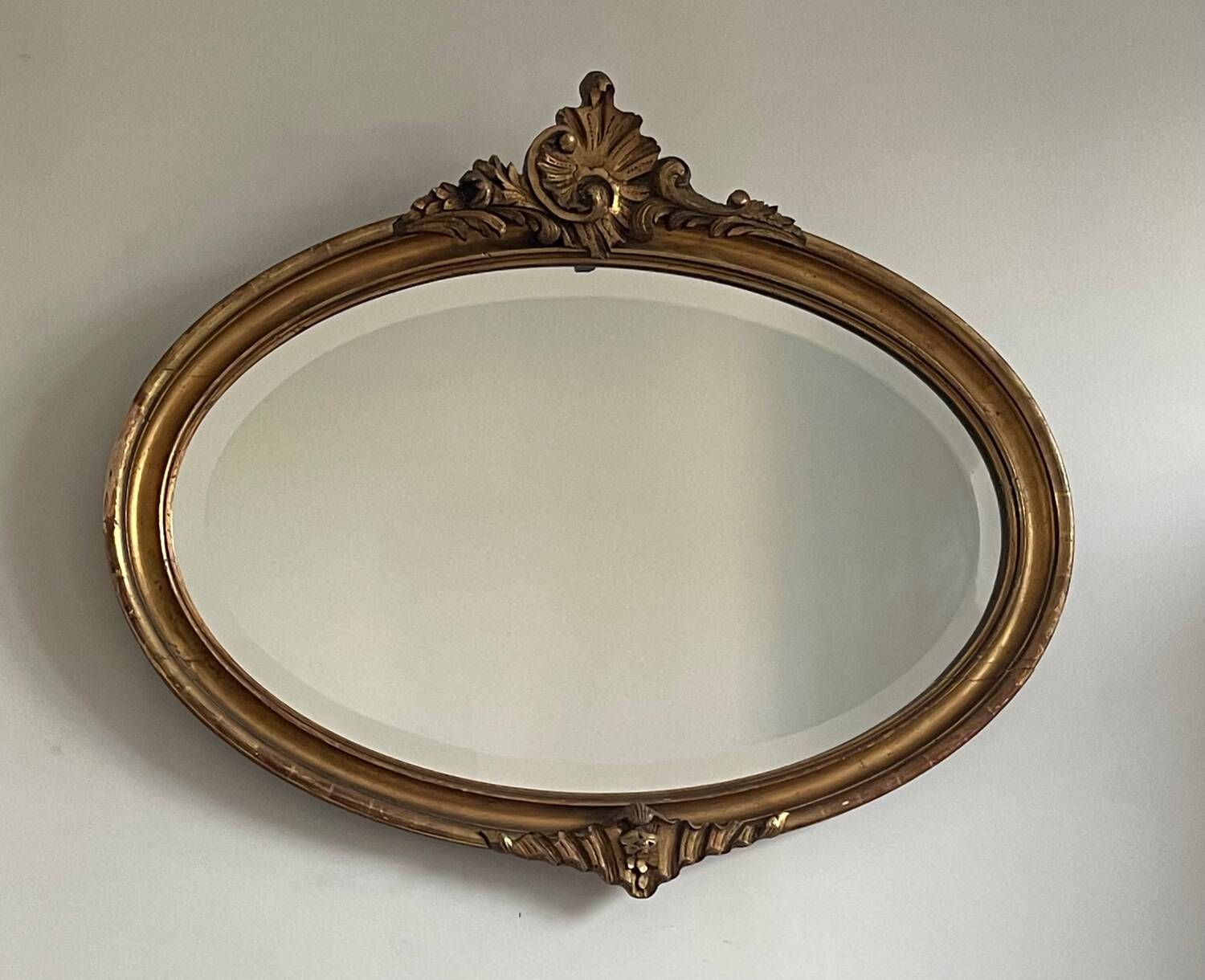 Antique oval gilt mirror.