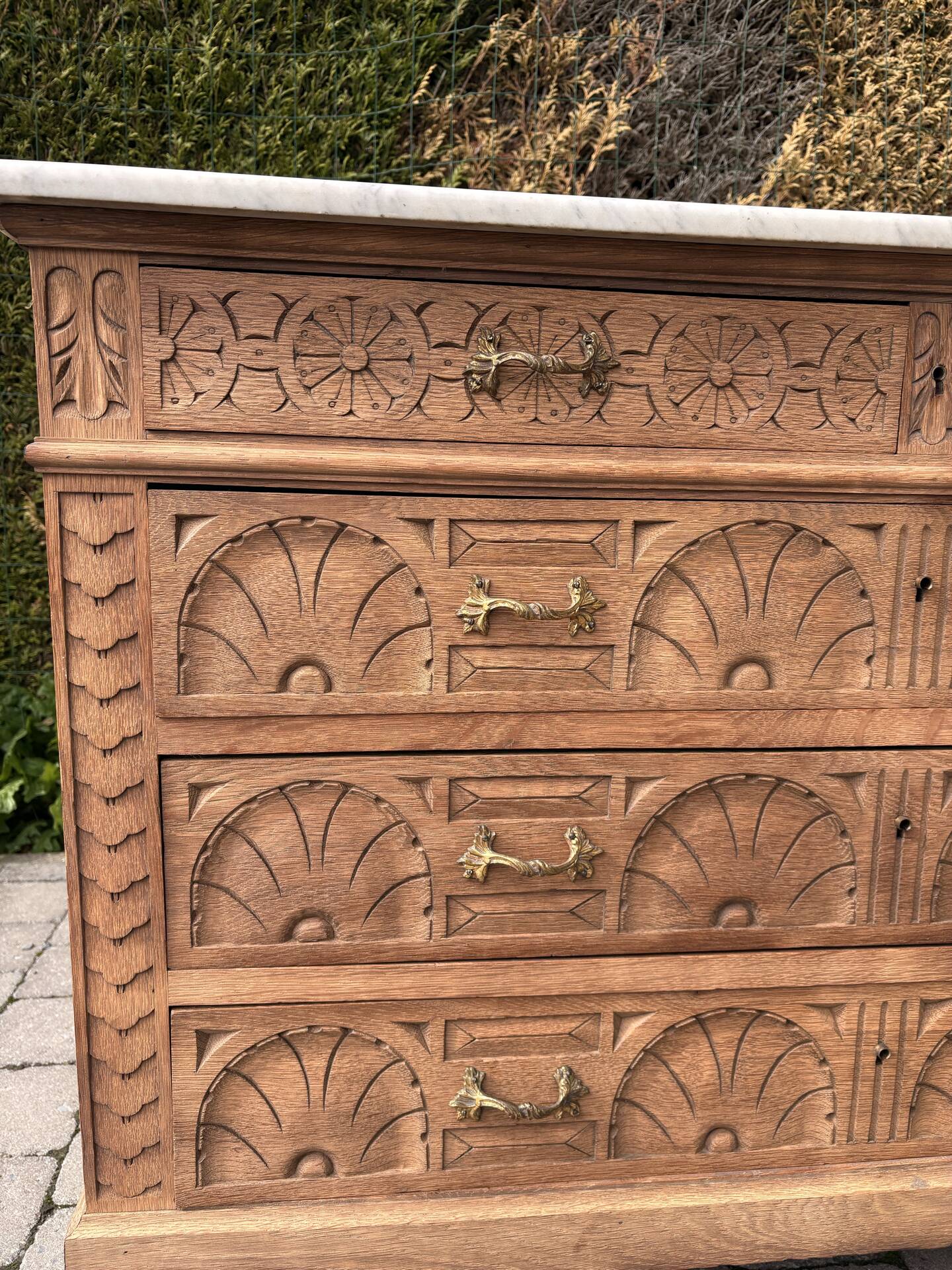 Solid oak chest of drawers with a marble top and original mirror.