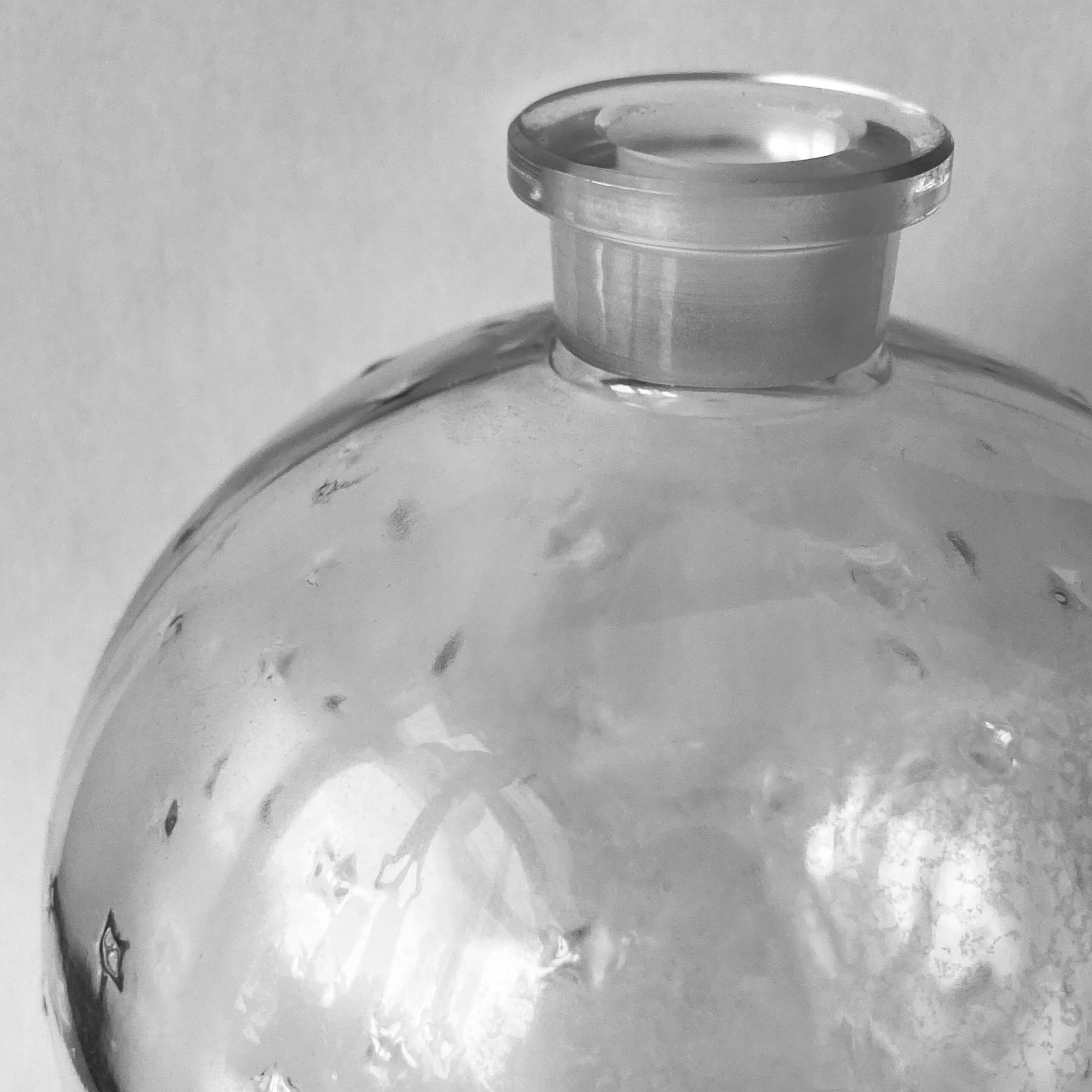 Lalique soliflore ball vase in colorless molded glass with light relief decoration of a seedling of stars