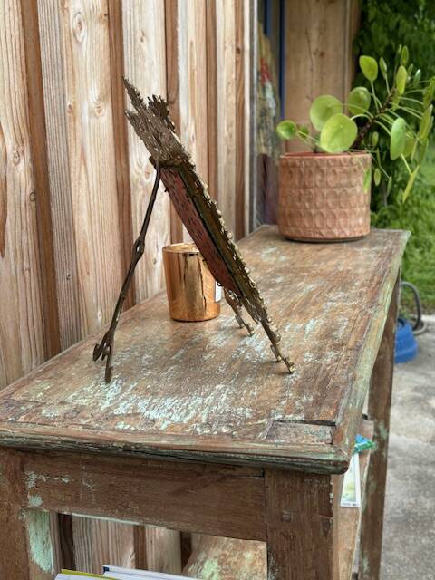 Teak shelves with a green patina