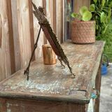 Teak shelves with a green patina