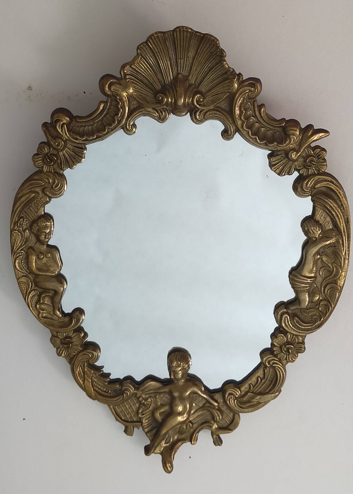 Gilded bronze mirror with angel ornament