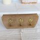 Vintage velvet coat rack with brass hooks