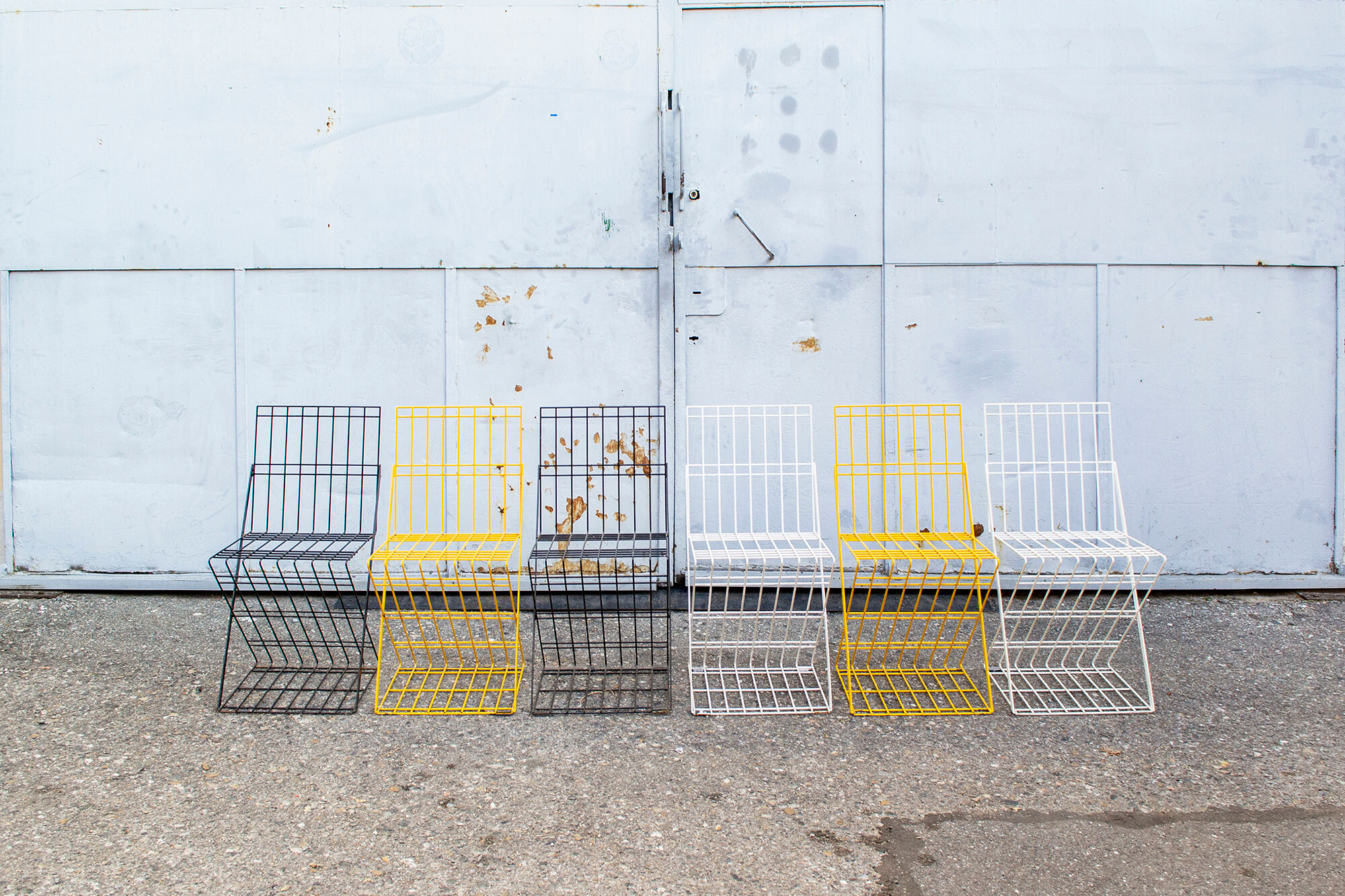 Stackable brutalist iron chairs Italy 70s
