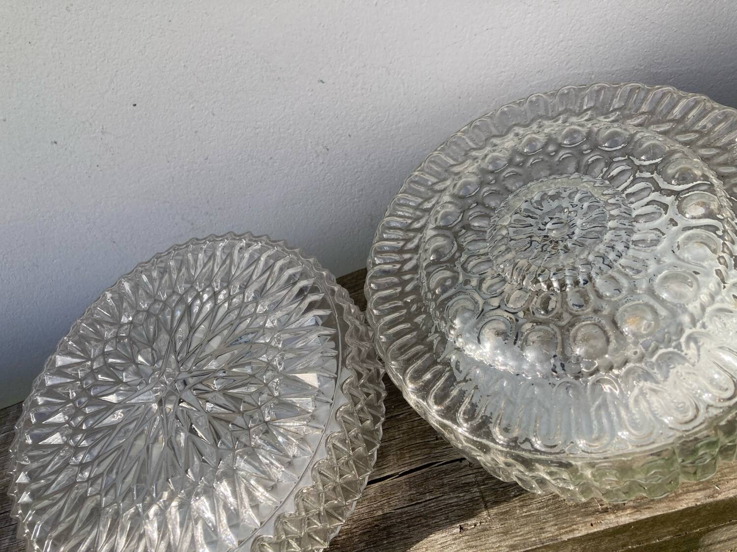 Pair of transparent round glass wall lights