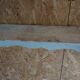 Patinated wooden wall shelf