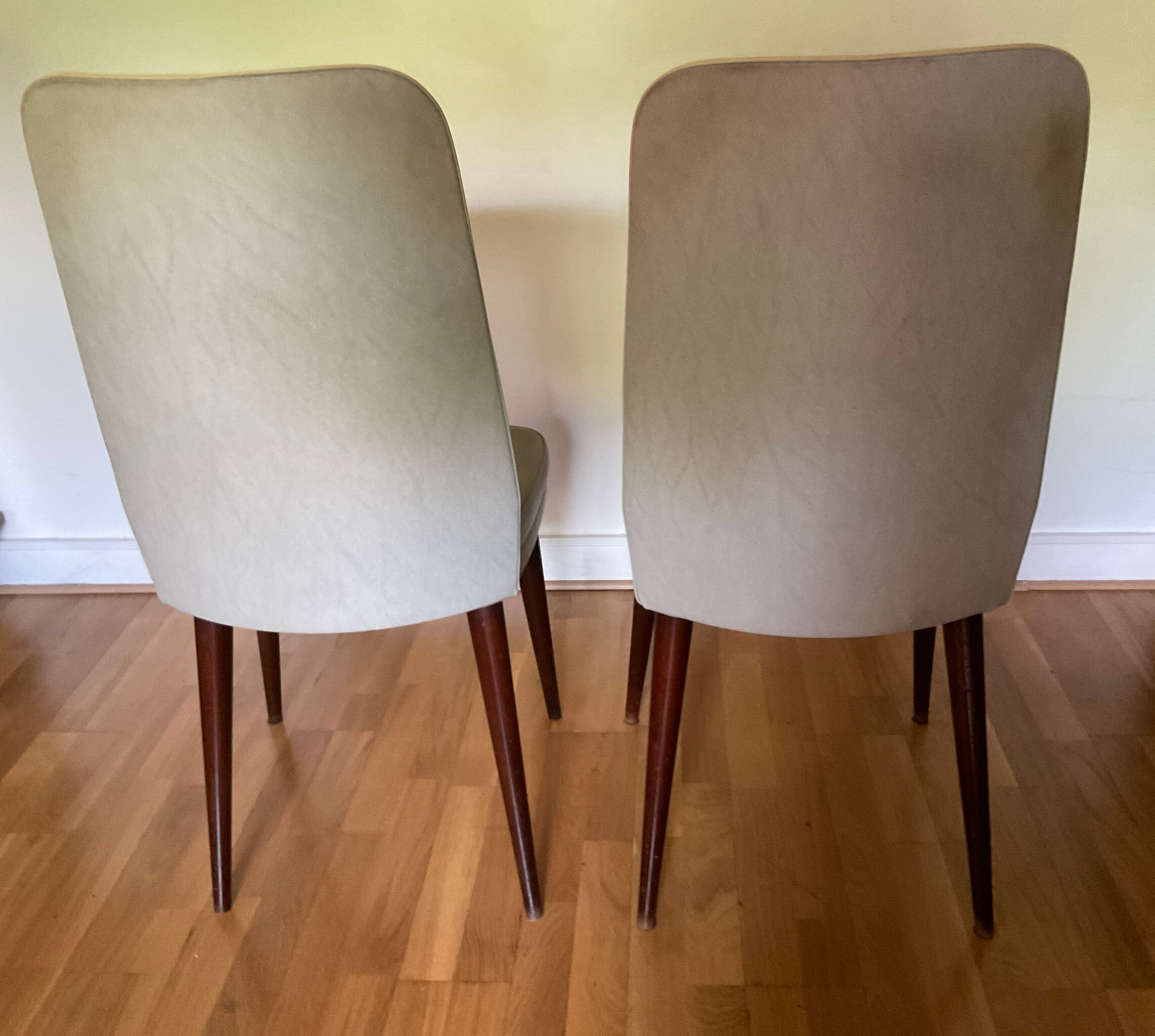 Pair of vintage mahogany and skai chairs