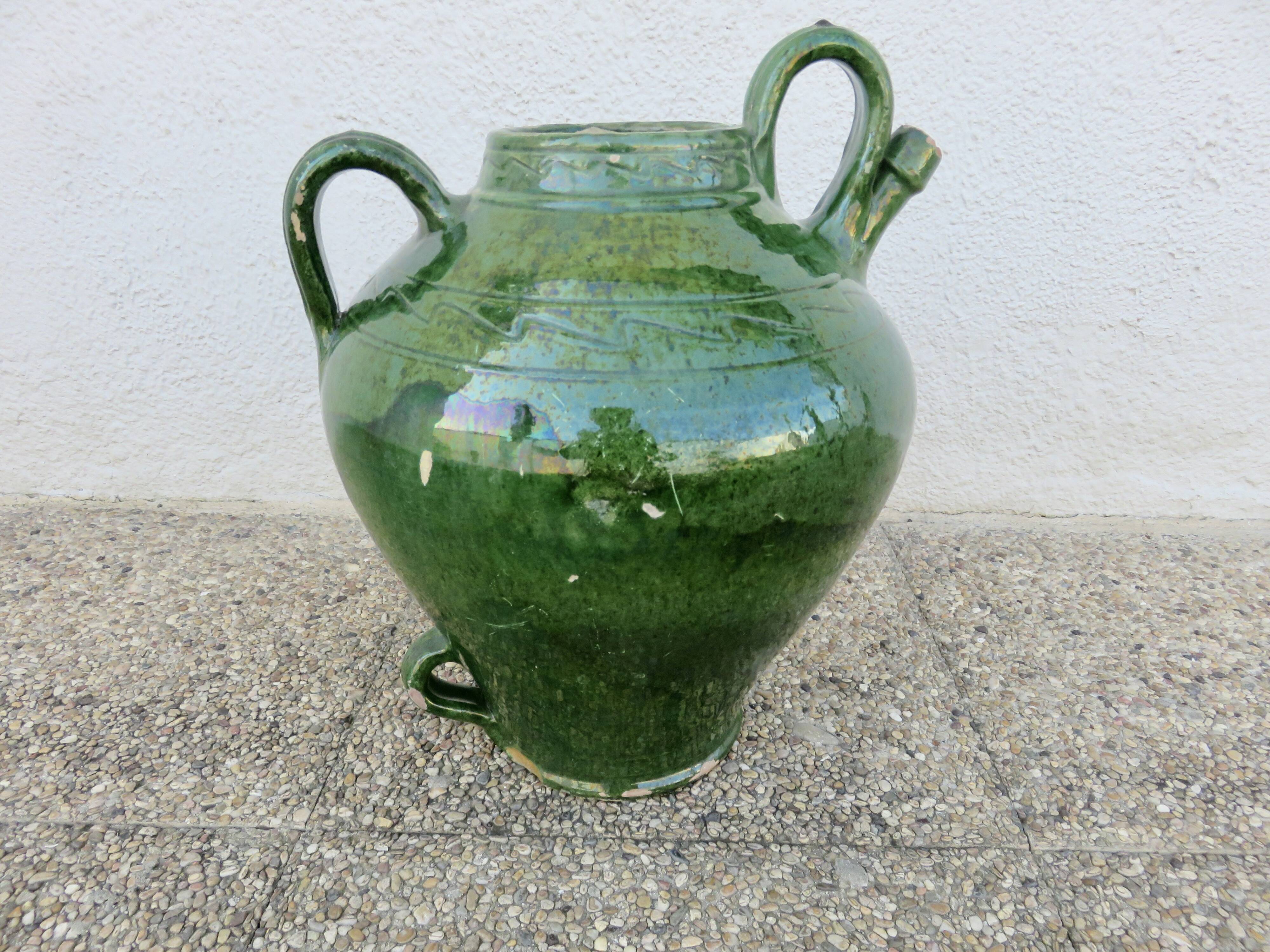 Antique glazed green terracotta oil jar, late 19th century.