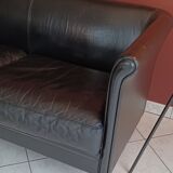 Black leather two-seater sofa