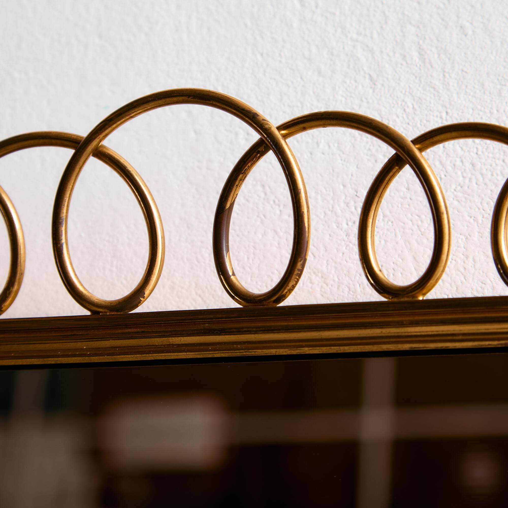 Metal and brass framed mirror