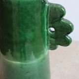 Handmade ceramic abstract vase with asymmetrical handles and fir green flowers