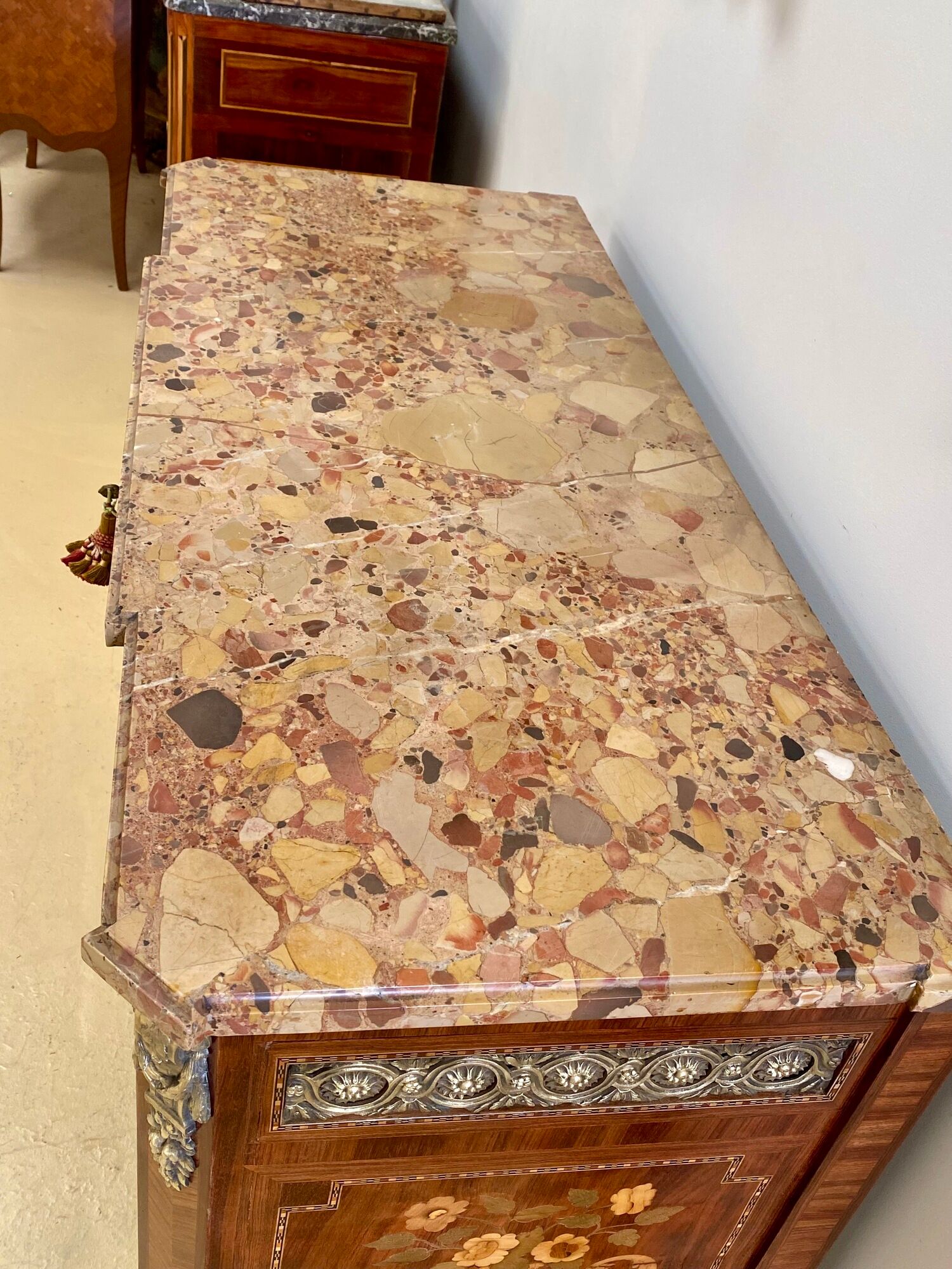Transition chest of drawers with floral marquetry and music trophy