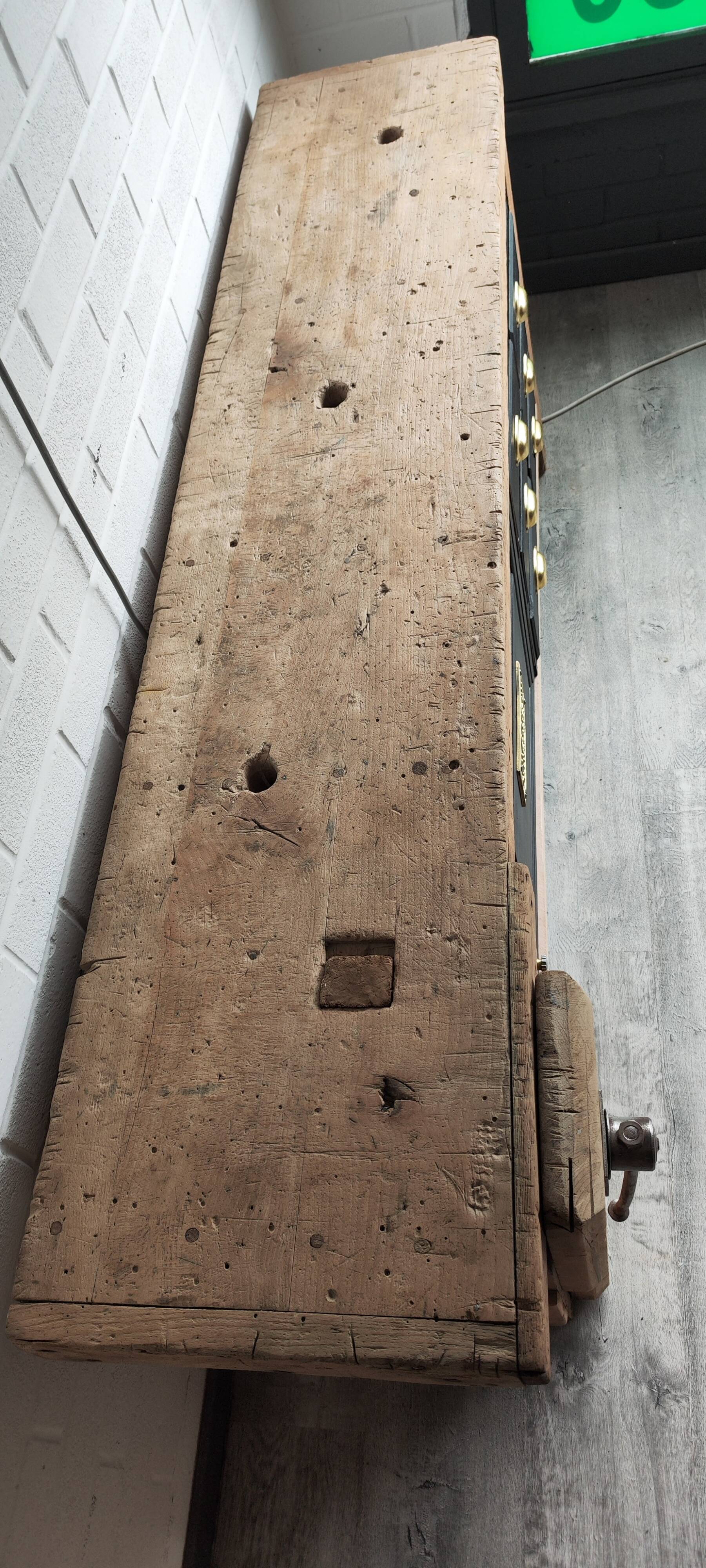 Old workbench furniture with six drawers and a door