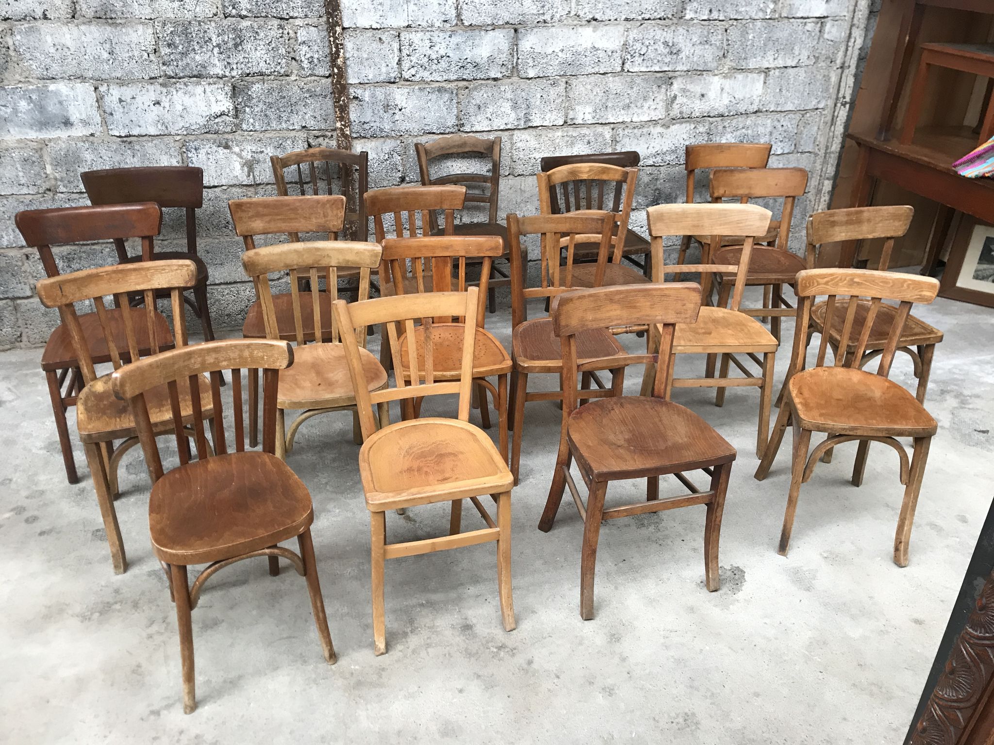 Set of 15 mismatched curved wood bistro chairs