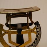 Former weighs metal letter