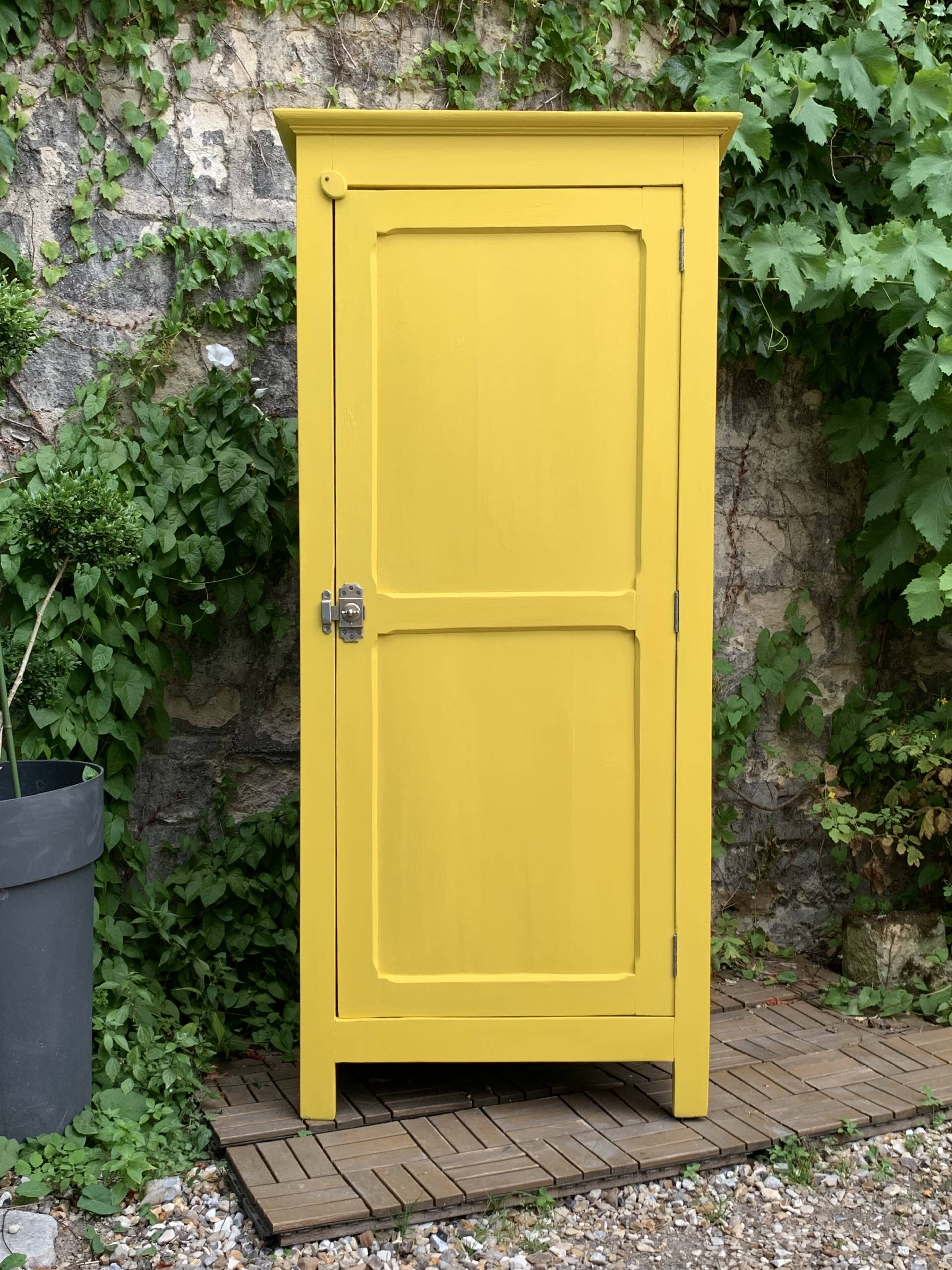 Antique powder yellow Parisian bonnetière wardrobe.