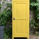 Antique powder yellow Parisian bonnetière wardrobe.