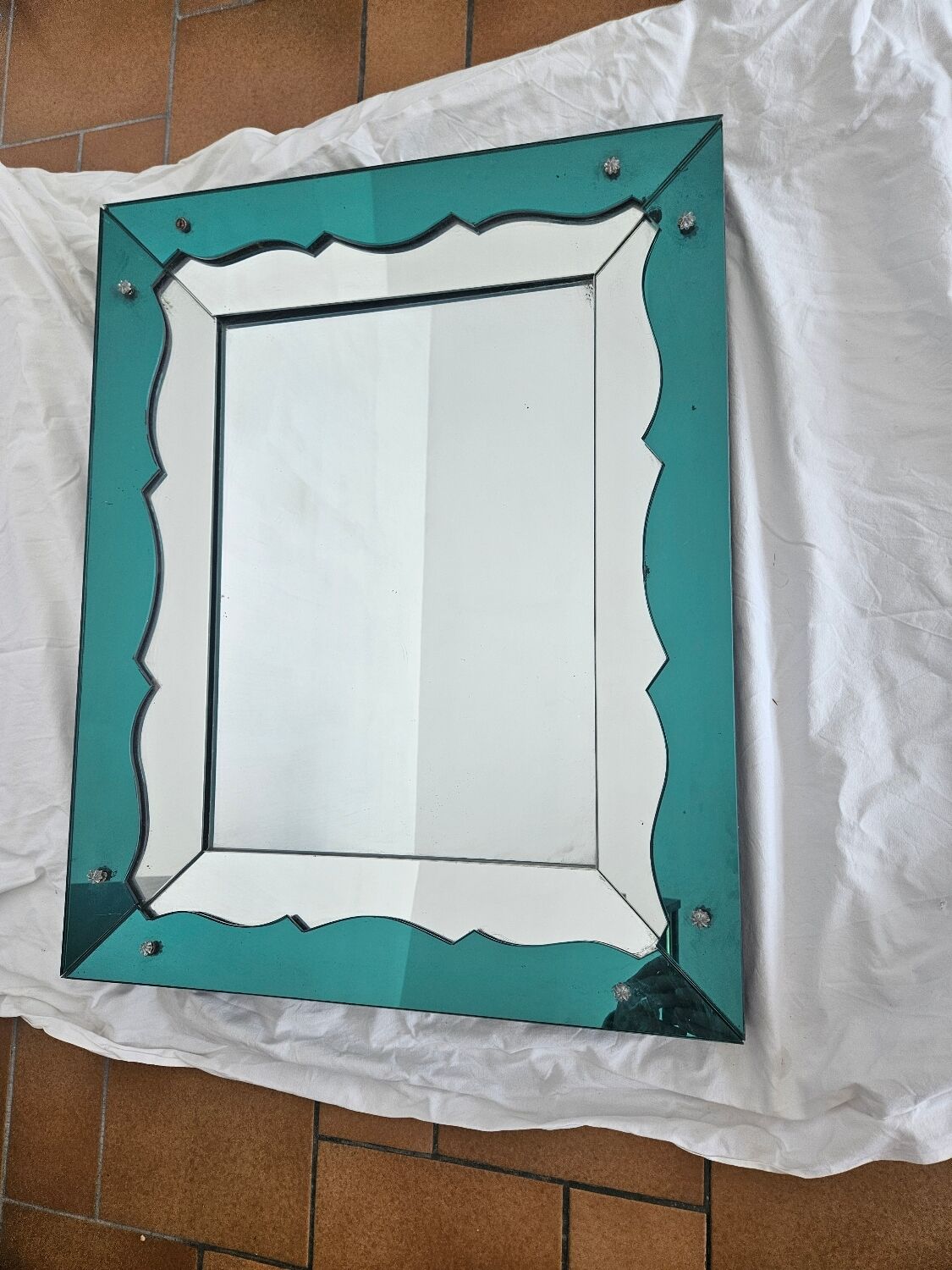 Turquoise green mirror in Hollywood Regency style