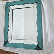 Turquoise green mirror in Hollywood Regency style