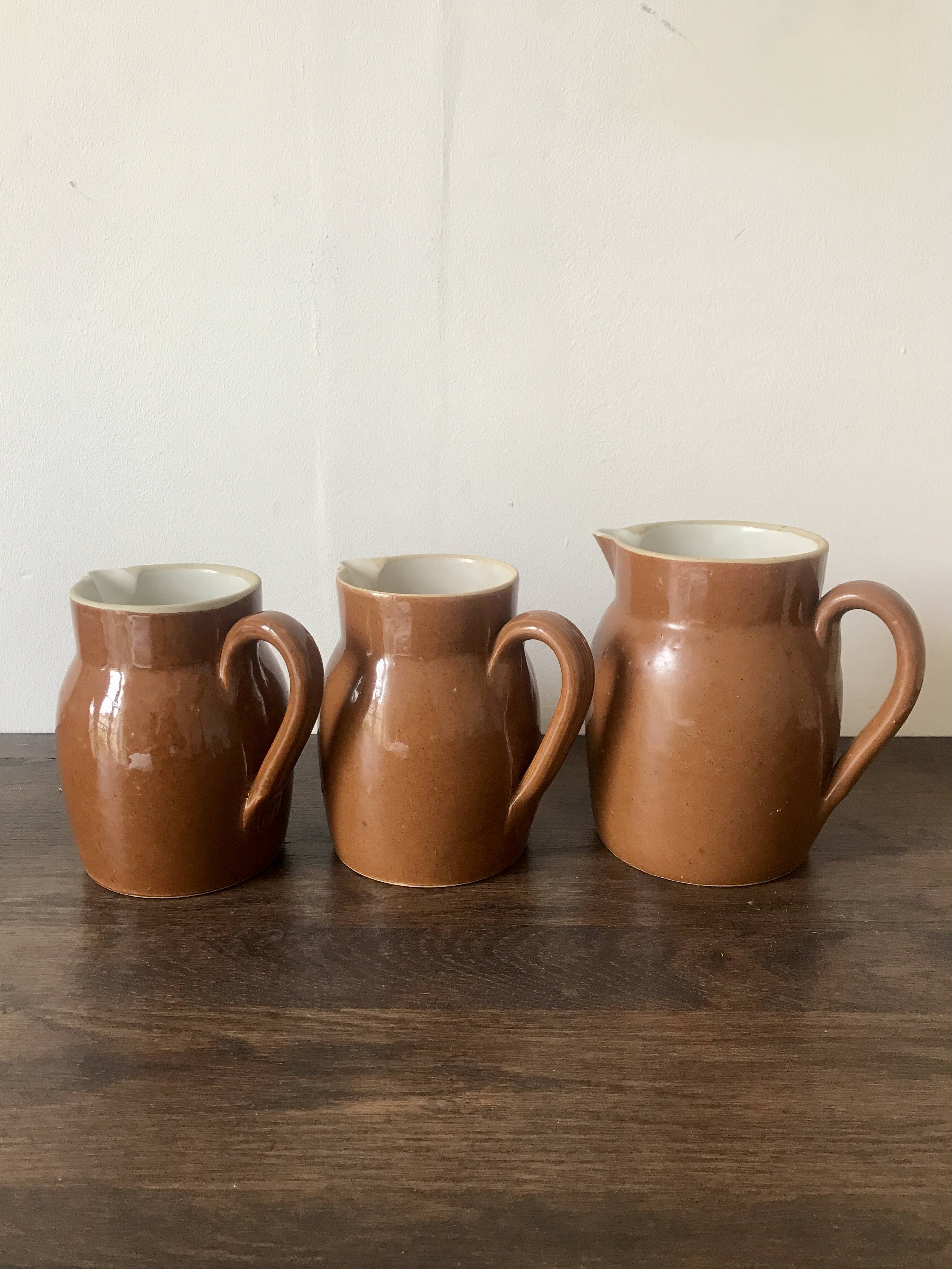 Set of 3 glazed stoneware jugs