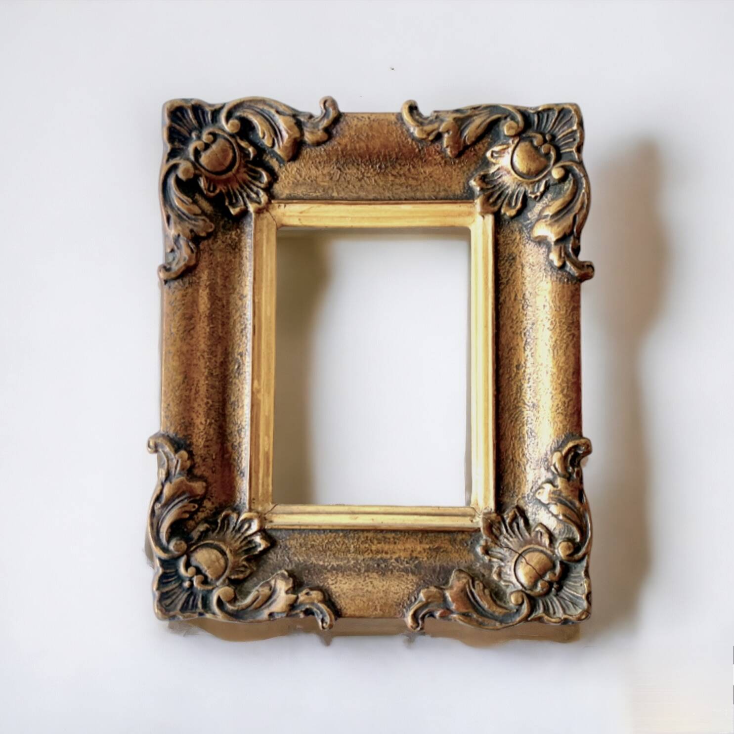 Pair of old carved wooden and plaster frames