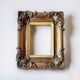 Pair of old carved wooden and plaster frames