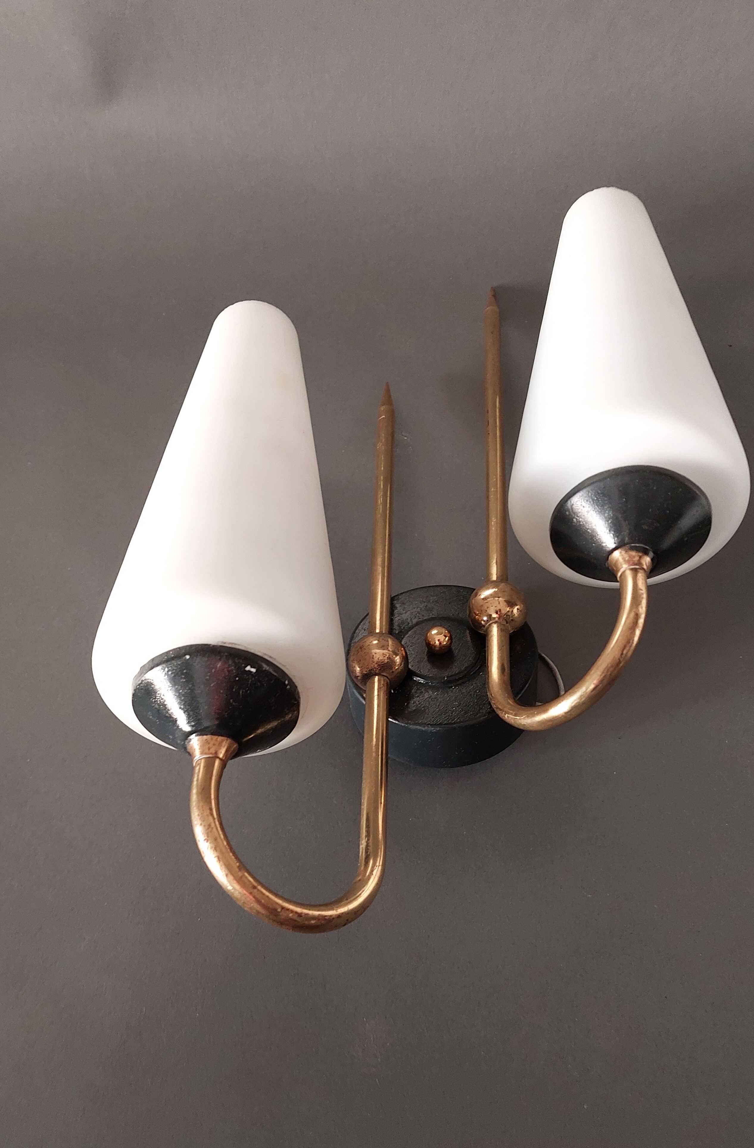 Pair of sconces in black metal and gilded brass 1960 Vintage.