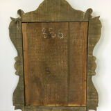 Miroir en bois doré et patiné sculpté 55 x 37cm