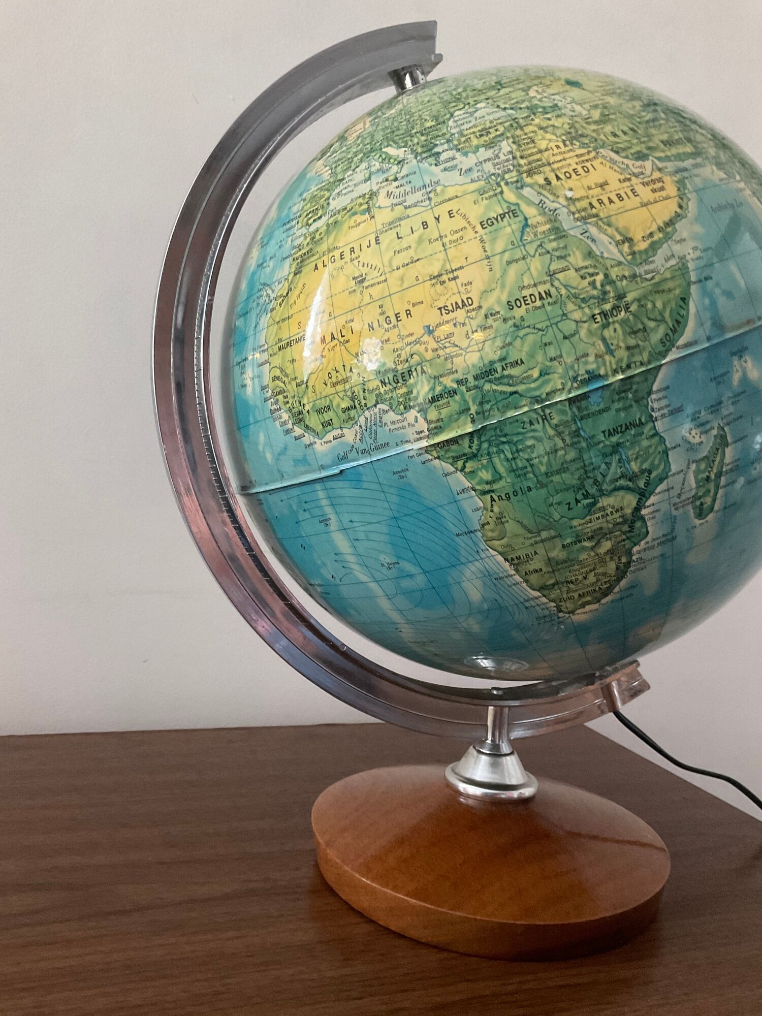 Bright vintage world map with wooden foot