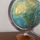 Bright vintage world map with wooden foot