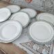 Set of 7 Longwy France earthenware dessert plates, Trianon model