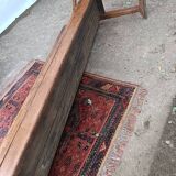 Oak church bench period XVII th century, back decorated with carved parchments