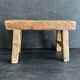 Ancient Chinese farm bench in patinated wood, small rustic stool.