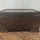 Old Indian wooden wedding chest decorated with chiseled brass plaque. India late 19th/early 20th