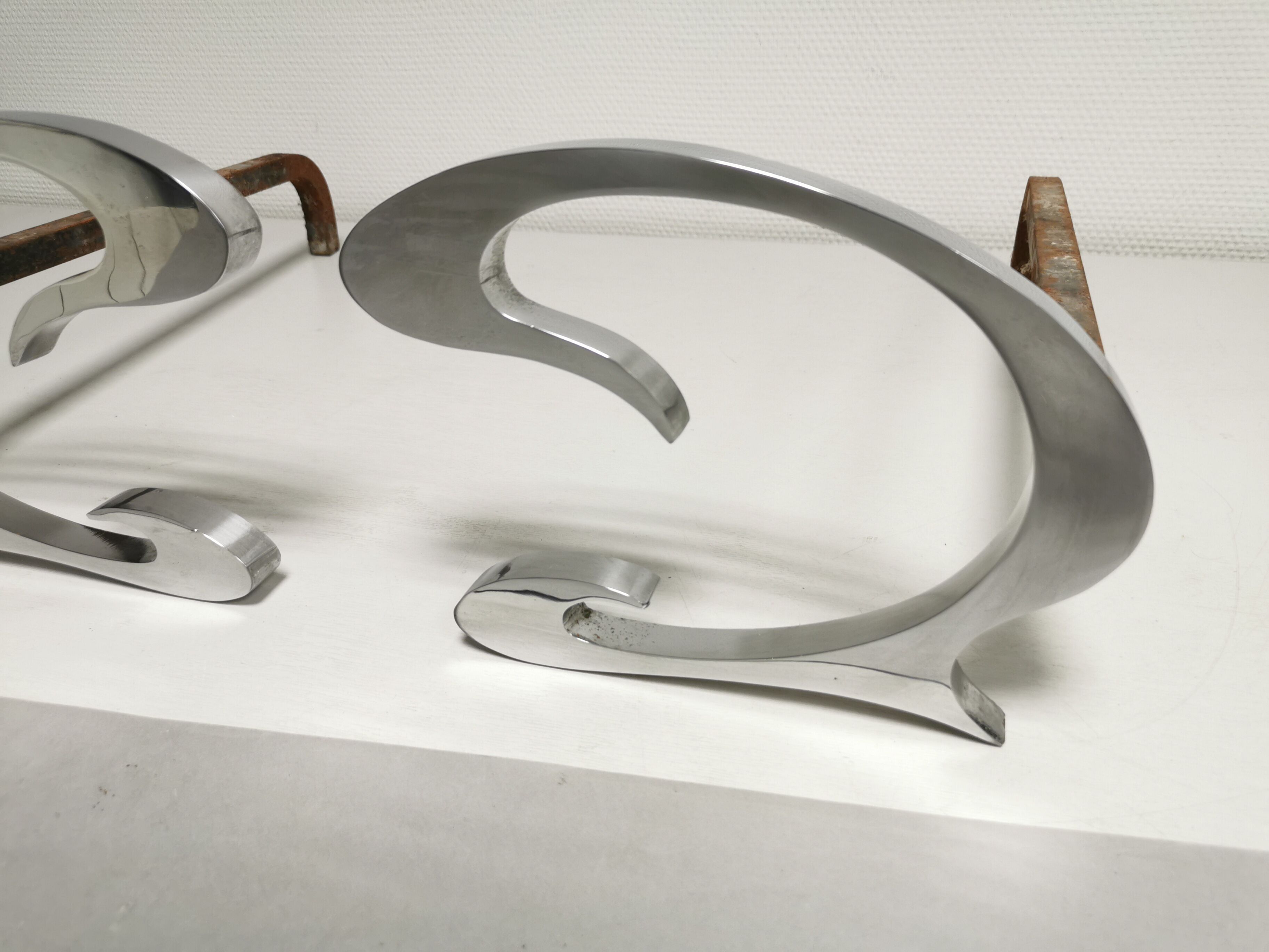Pair of andirons in brushed steel and metal edition Jean-Paul Créations circa 1970