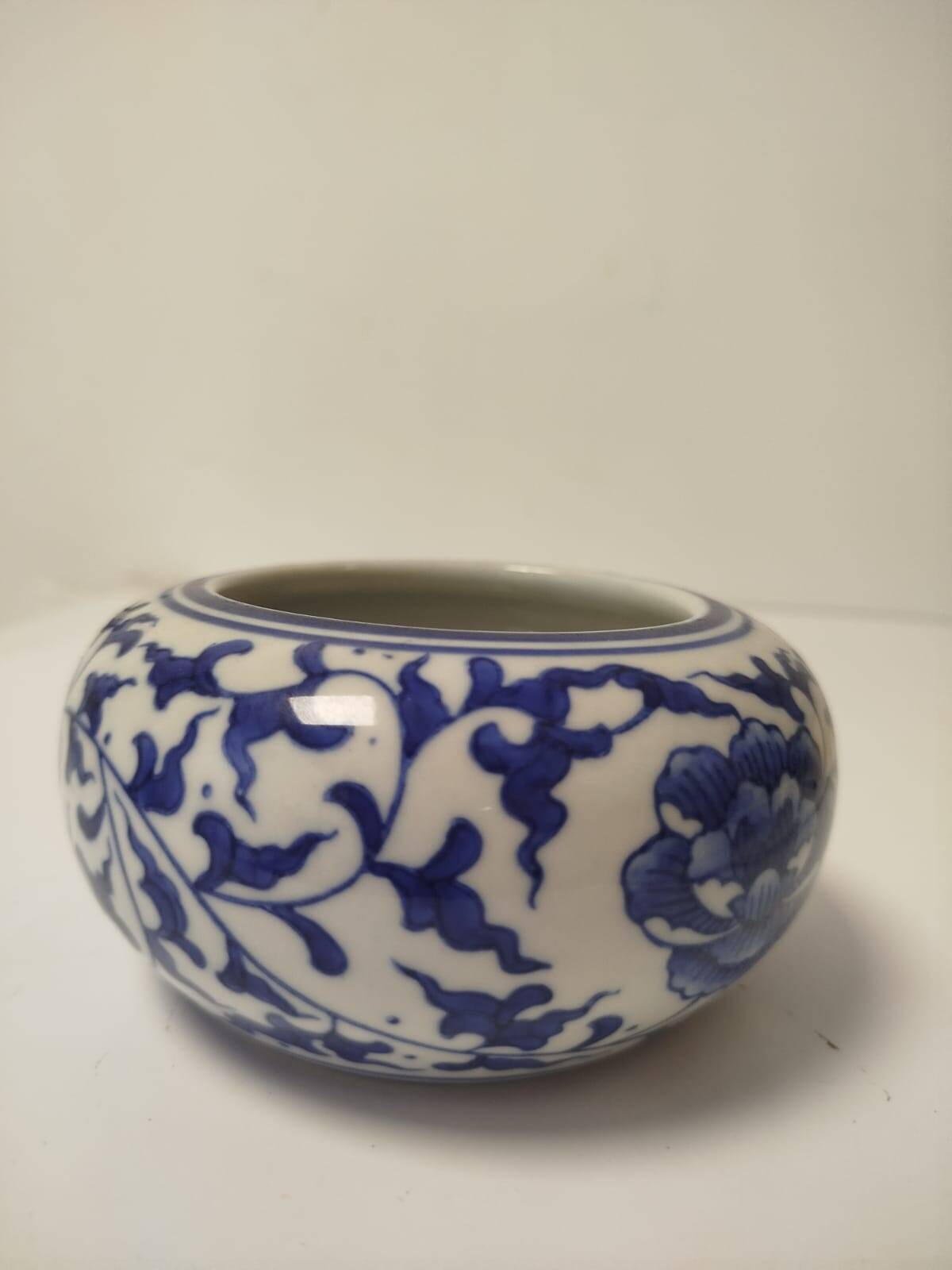 Small round Chinese-style porcelain pot with blue and white decoration