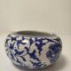 Small round Chinese-style porcelain pot with blue and white decoration