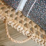 Doll bassinet with its bedding