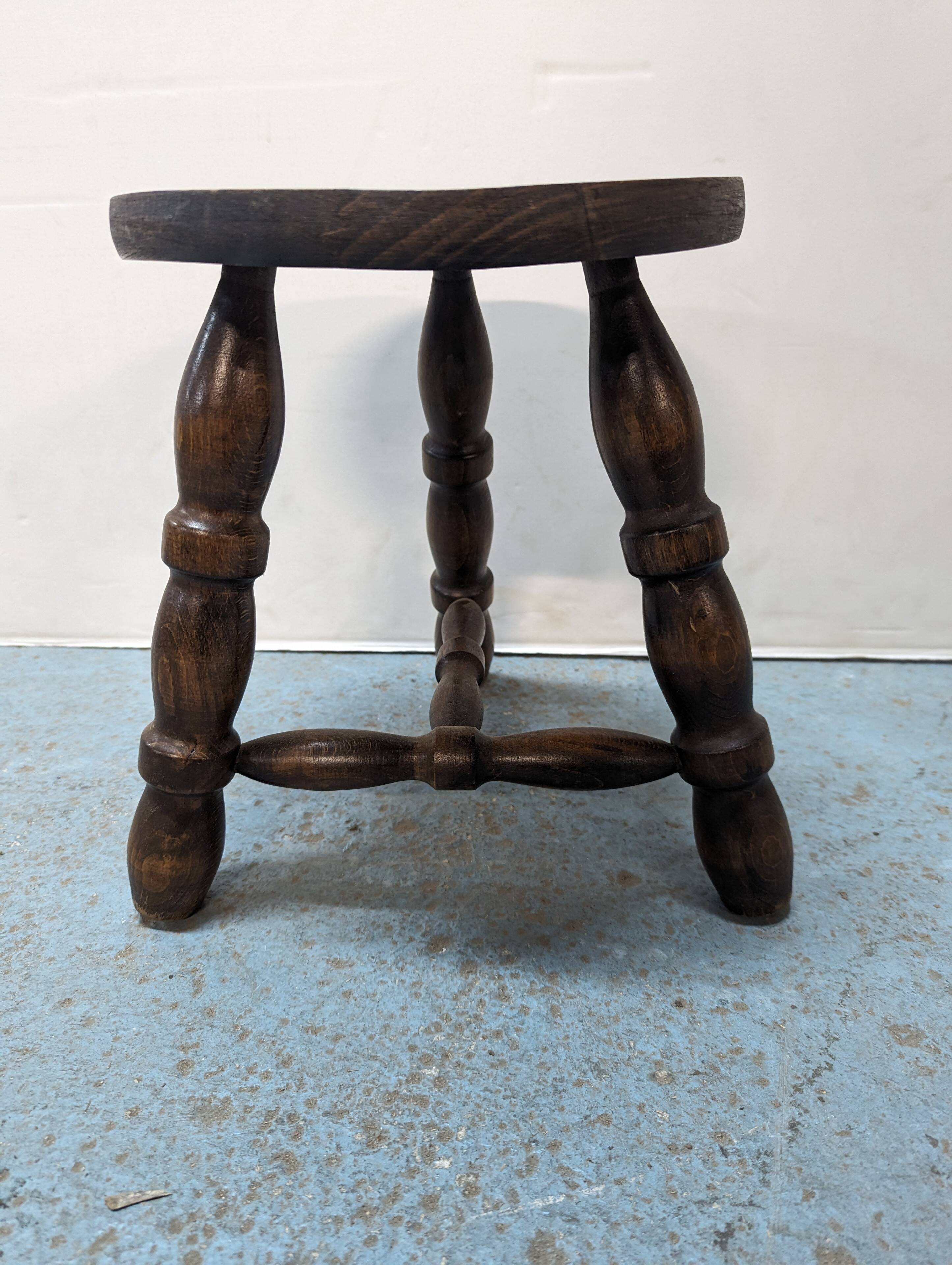 Rustic three-legged oak stool