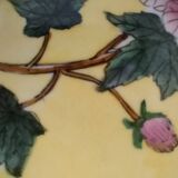 Pair of vintage Chinese decorative plates with floral decoration on a yellow background