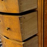 Half-moon commode in burl wood with a marble top.