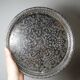 Small Moroccan tripod tea tray in silver-plated metal, vintage chiseled decoration.