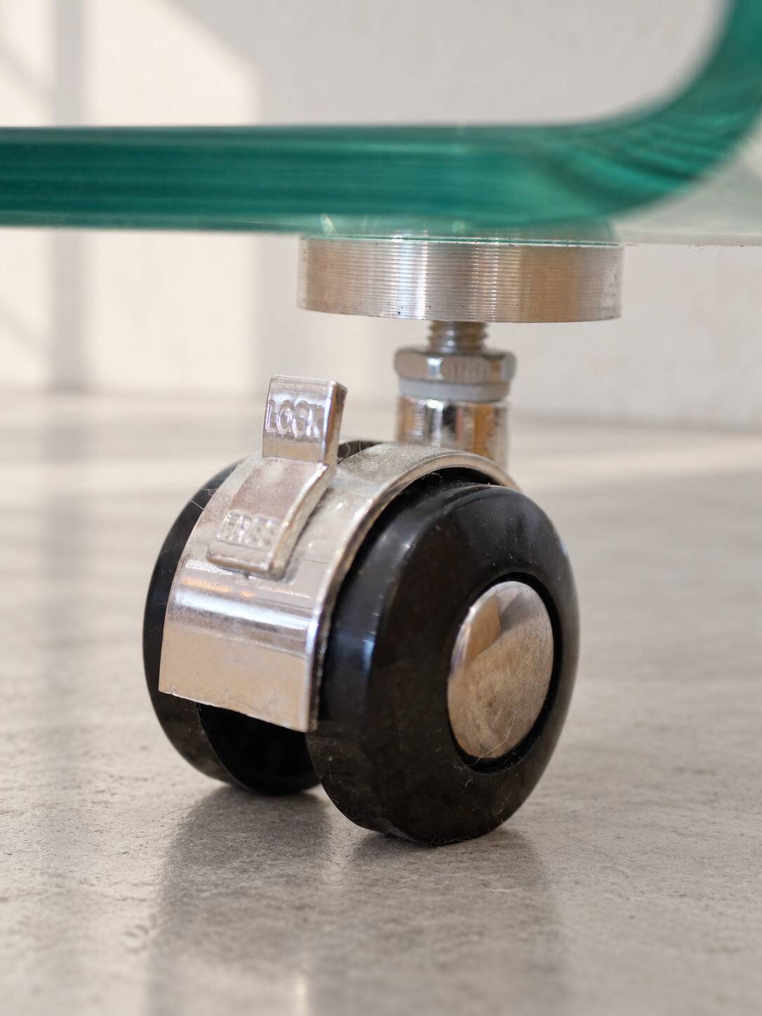 Glass coffee table on wheels