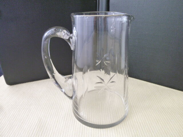 Jug, water decanter or fruit juice in grinded glass