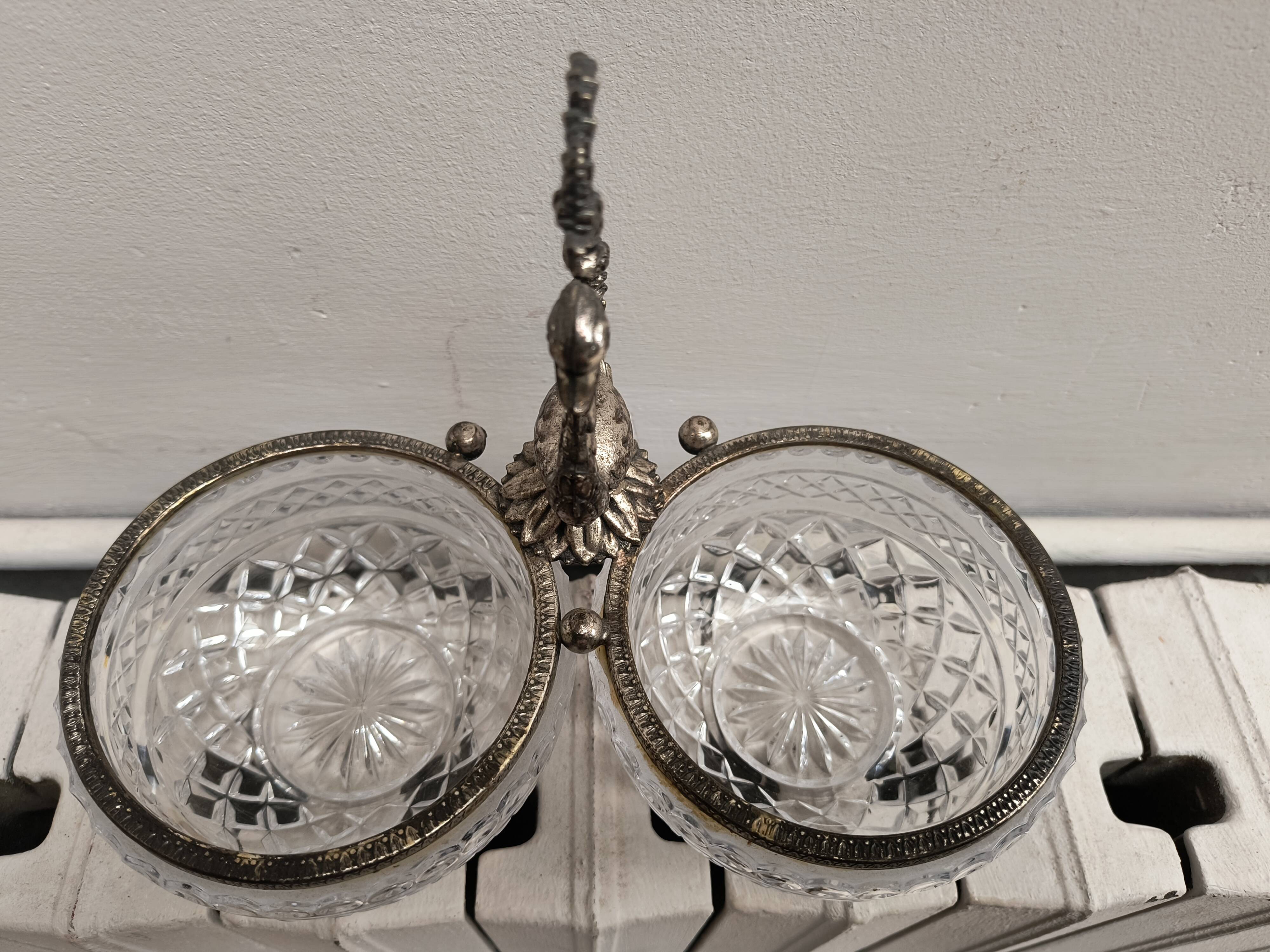 Crystal bowls joined by "swan neck" creation.