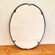 Vintage enameled blue oval mirror
