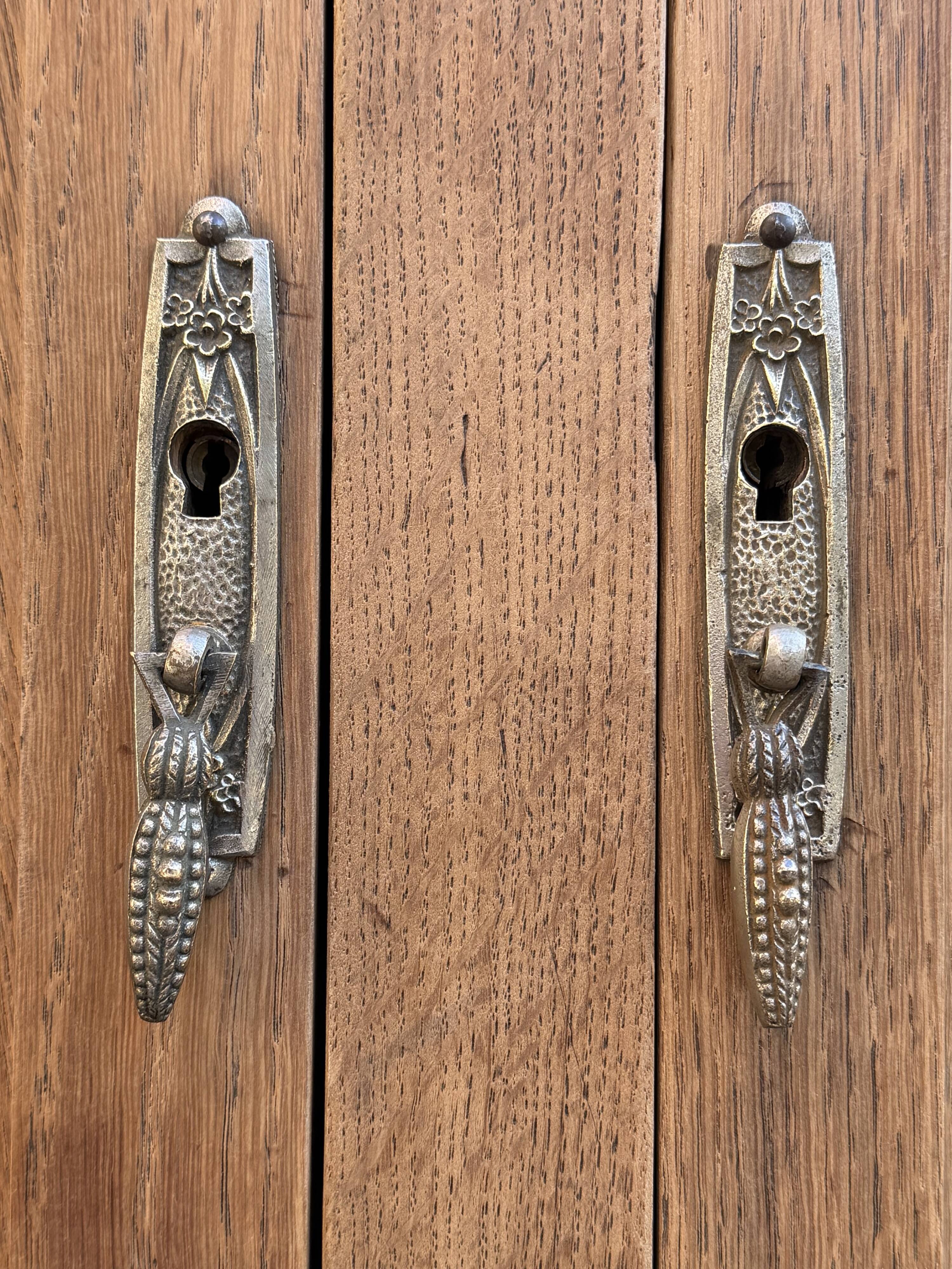 Art deco wardrobe in raw oak with bevelled mirror.