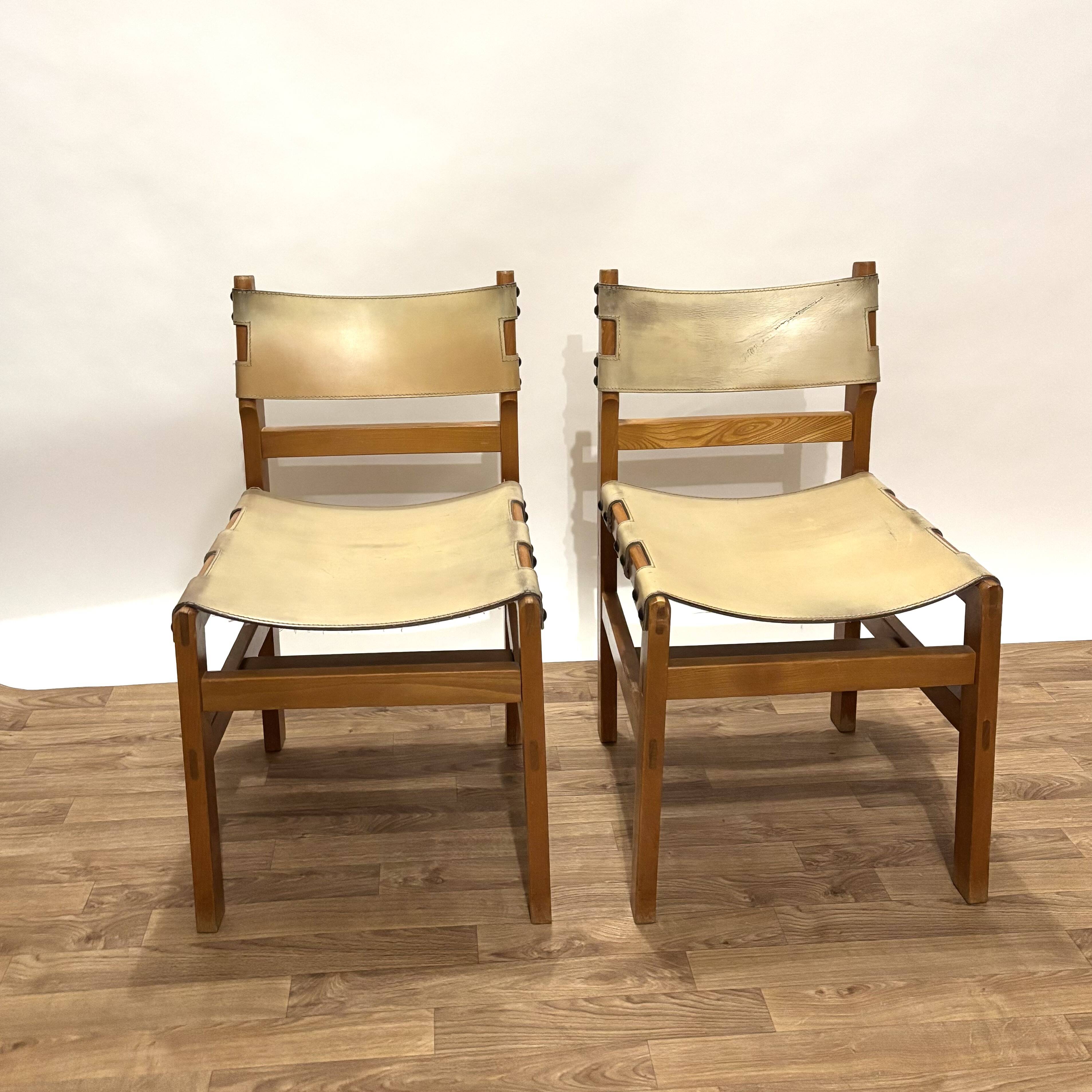 Pair of Maison Regain leather chairs